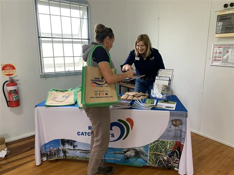 Staff talking with visitors at a Reef Catchments stall